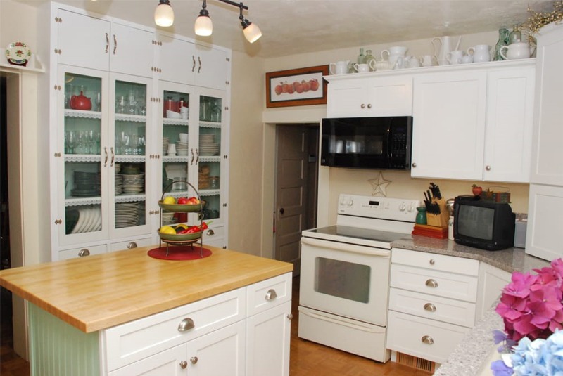 Country styled cabinets with butcher block island