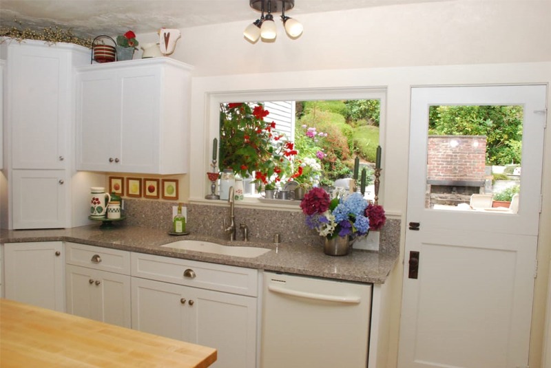 Kitchen sink and dishwasher, with beautiful view of the yard