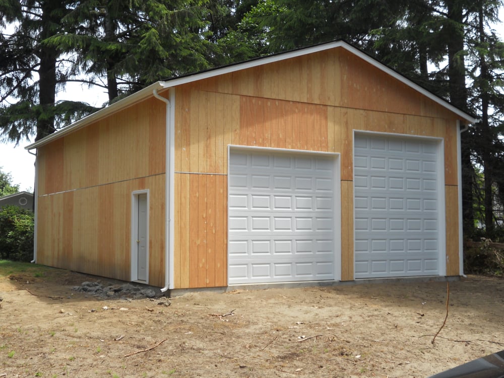 Garage doors, gutters and side door installed